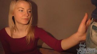 Whorish blond teen offers a competent footjob to huge dick